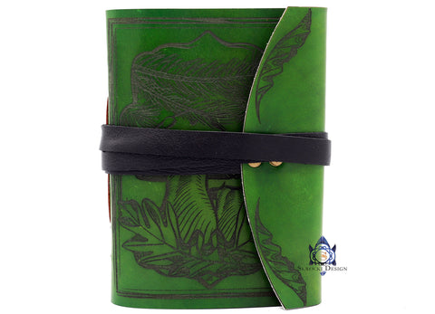 Mushrooms nested in Burr Oak leaves under a Pine Tree forest green leather journal